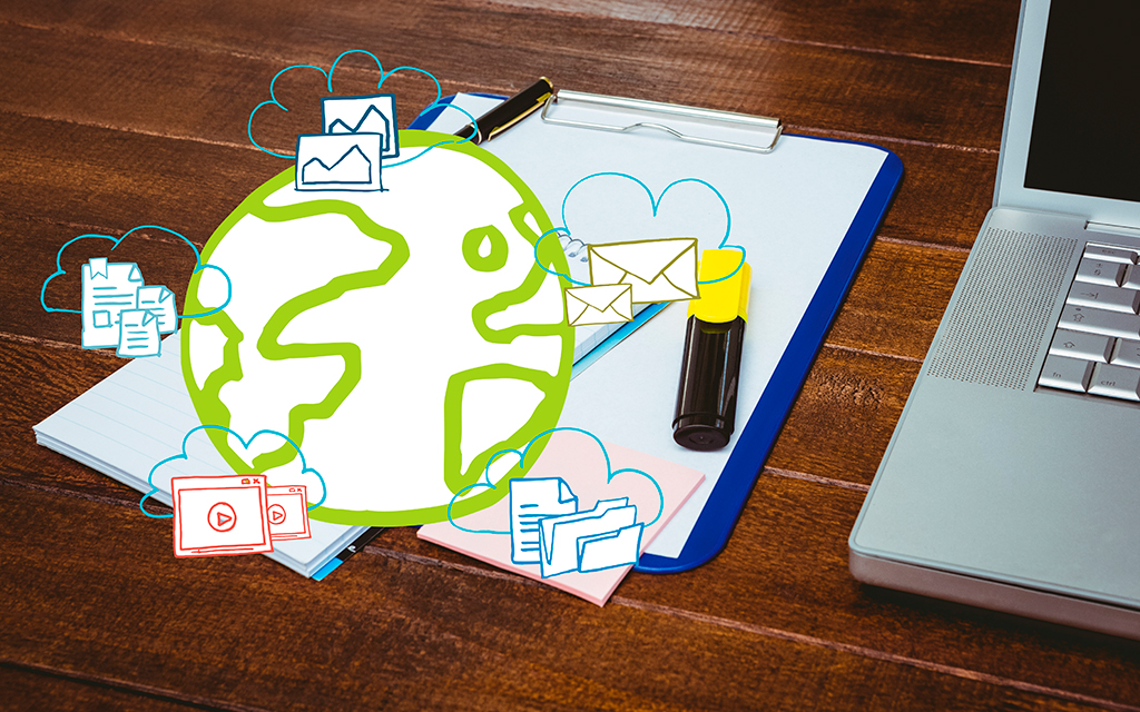 Global digital communication and online content concept with a globe, emails, documents, images, videos and a laptop